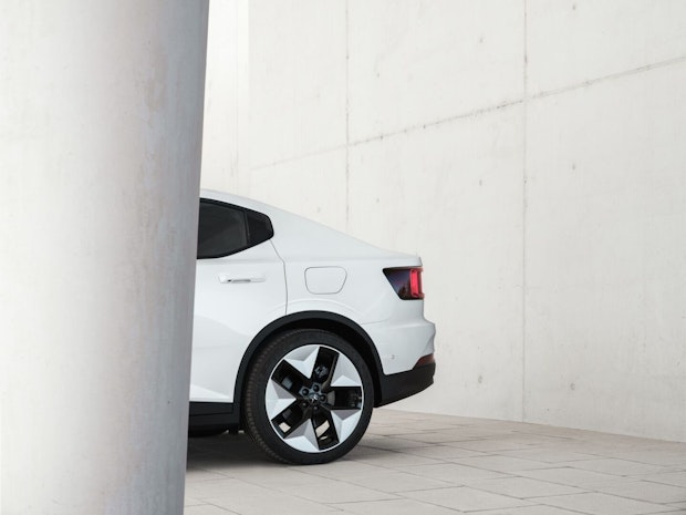 Back of Polestar 2 with Snow exterior on white industrial background