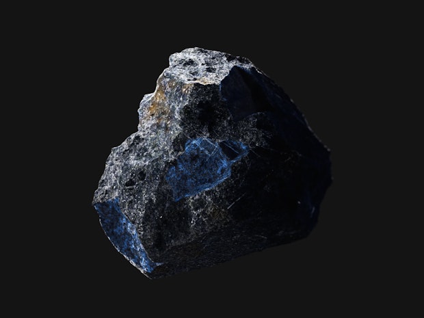 A piece of Cobalt on a black background.
