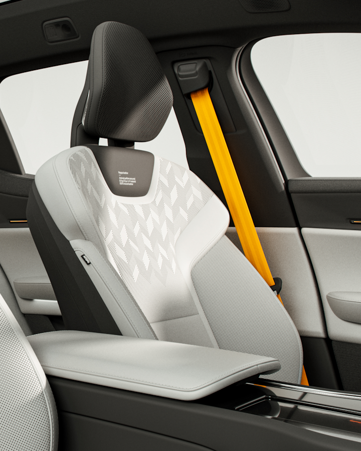 Polestar 3 interior, side view of front and back seats and signature seatbelts.