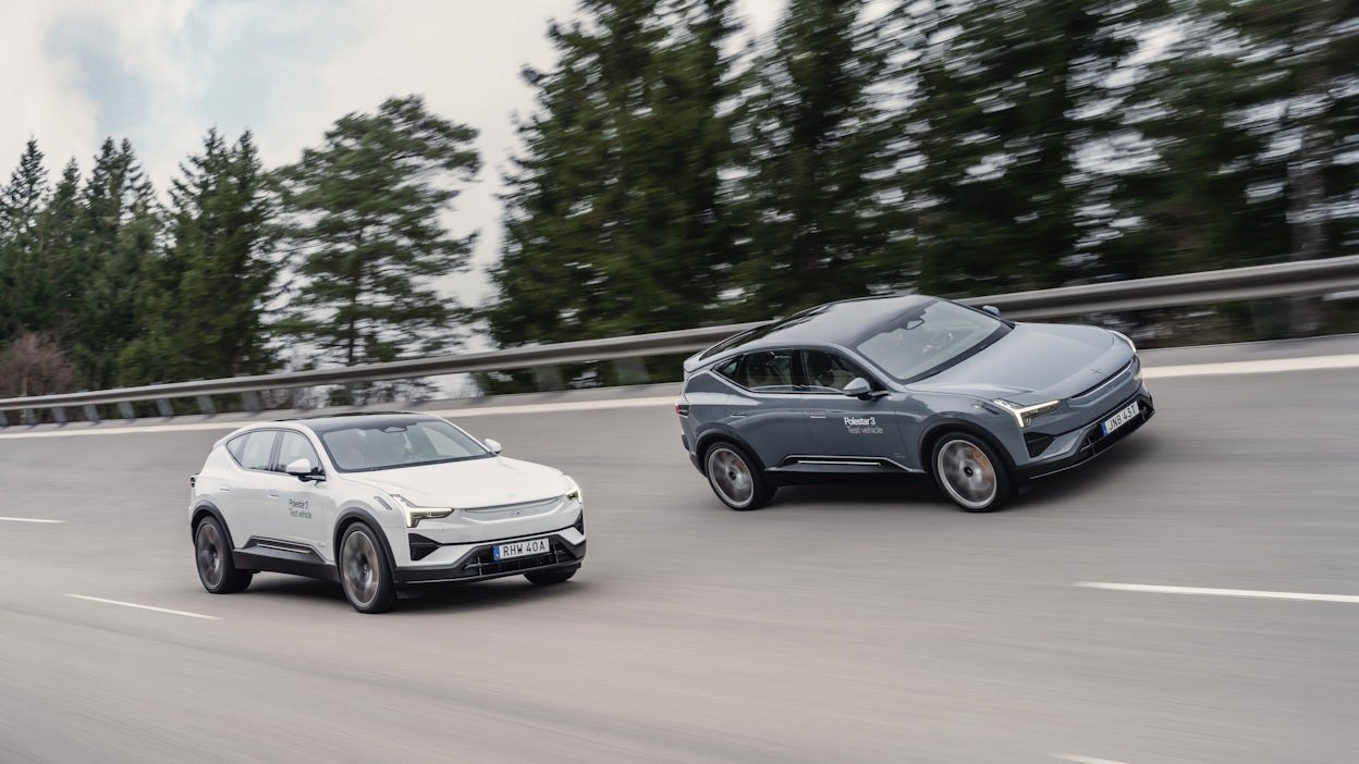 Two Polestar 3 prototypes driving alongside each other at Hällered track.