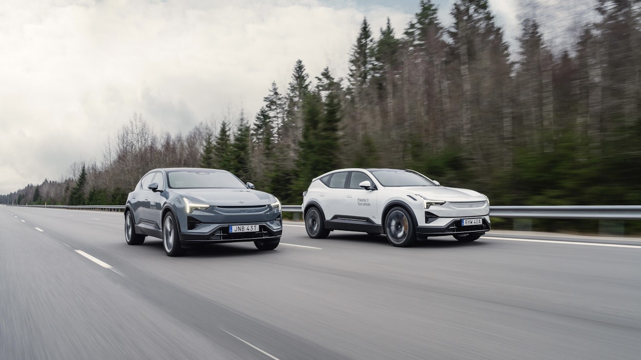 Two Polestar 3 prototypes driving alongside each other at Hällered track.