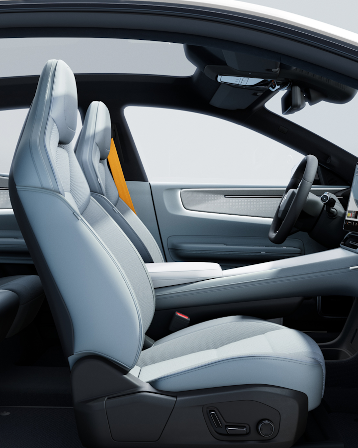 Interior of Polestar 4 seen from the side. Light upholstery, yellow belts.