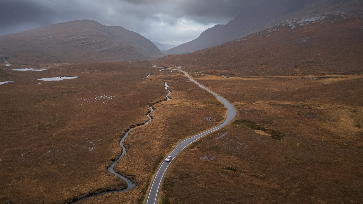 Polestar 2 on a lonely road in Scotland.