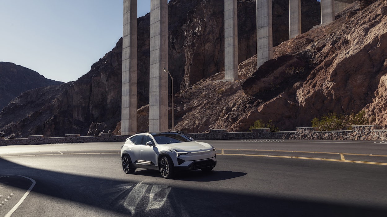 Polestar 3 driving under a bridge.