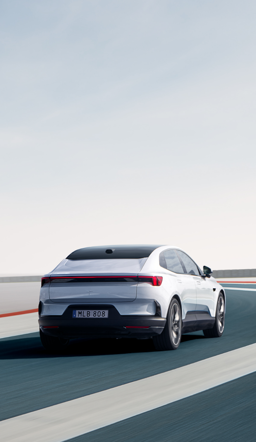 White Polestar 4 driving on a racetrack