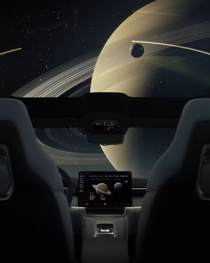 Interior of Polestar car with Saturn and its rings visible through the windshield, central screen displaying planetary data.