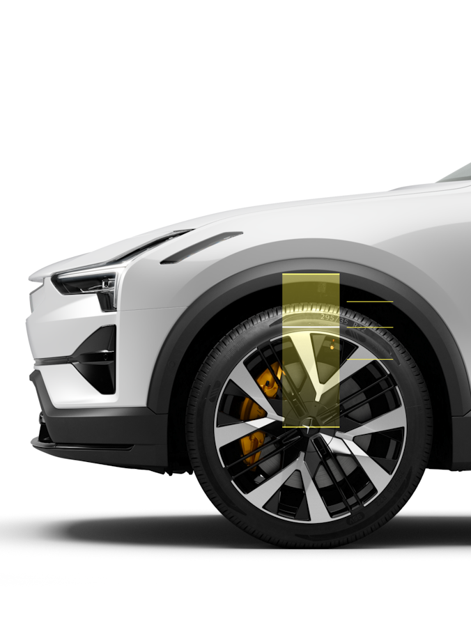 On a white background, an enhanced view of the wheel and suspension show the air suspension, with height adjusting.