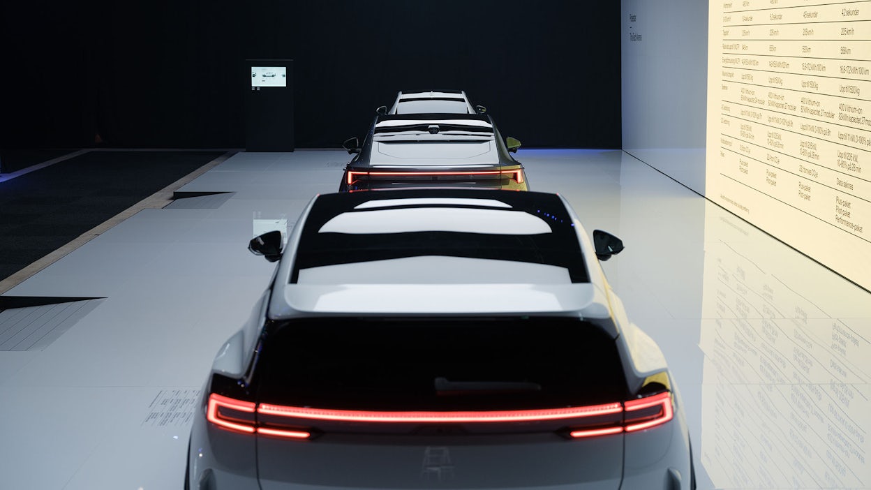Polestar 4, Polestar 3, and Polestar 2 lined up in front of each other, photographed from above to show their sunroofs and rear windows