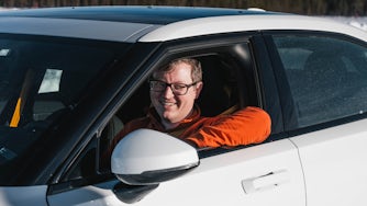 Gordon Murphy driving a Polestar 2 in the Polestar Arctic Driving Experience.