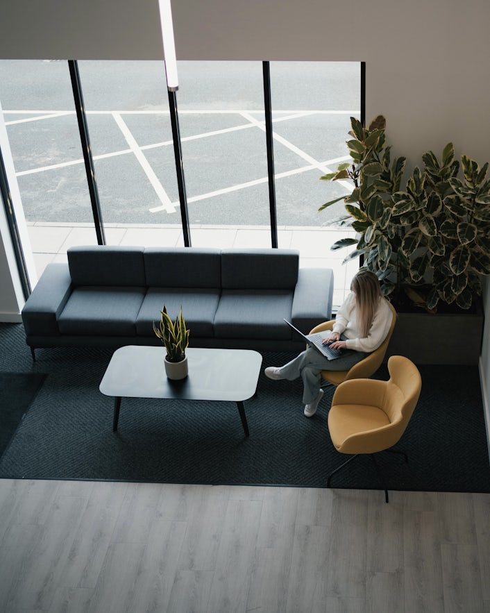 A overlook of Bethany working in the Mira office.