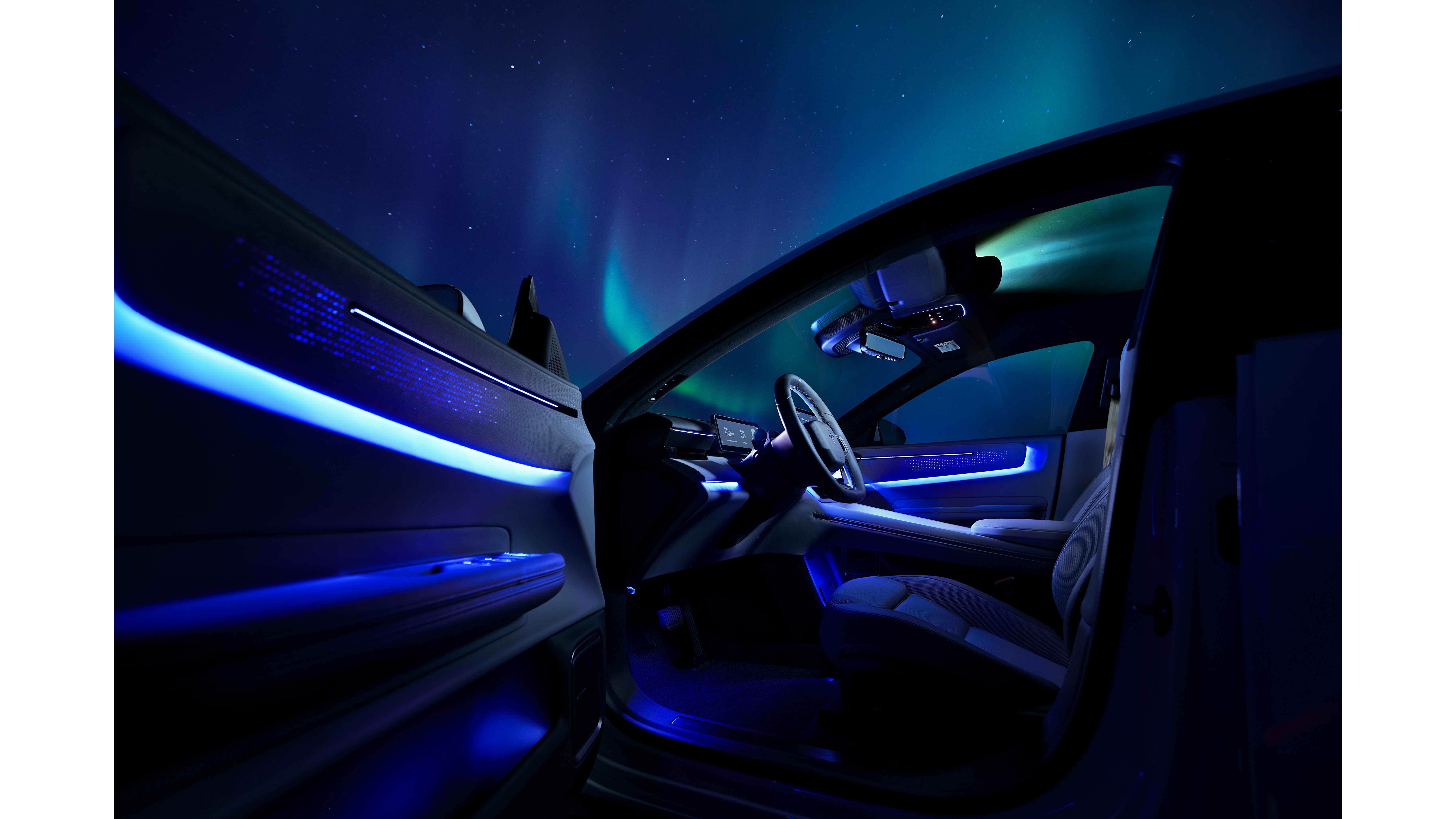 Interior illumination in Polestar 4 with Northern Lights backdrop.
