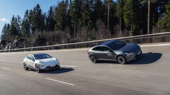 Two Polestar 4's driving on track.