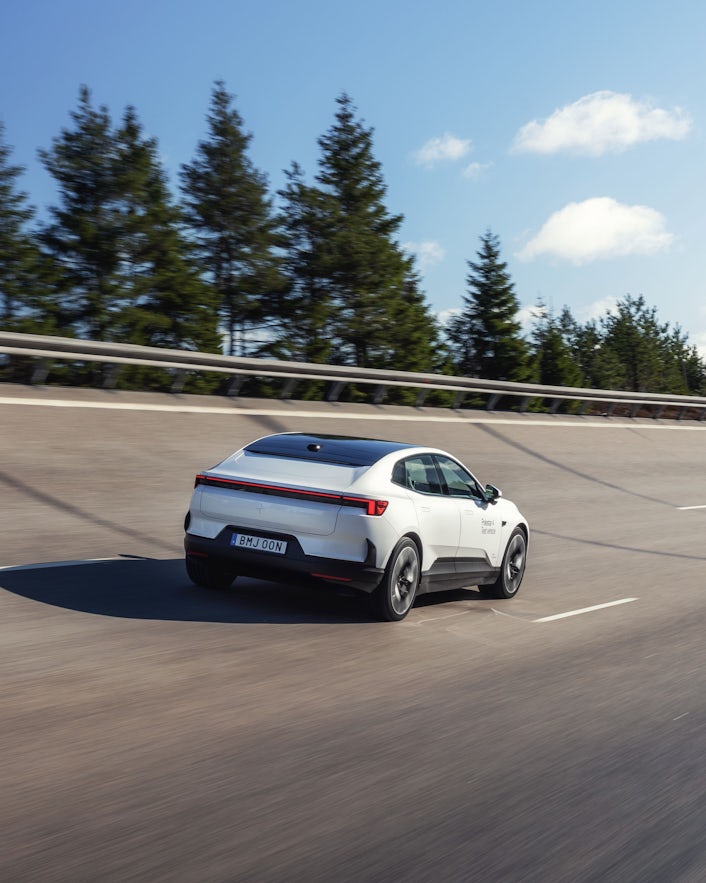 Polestar 4 rear driving on track.