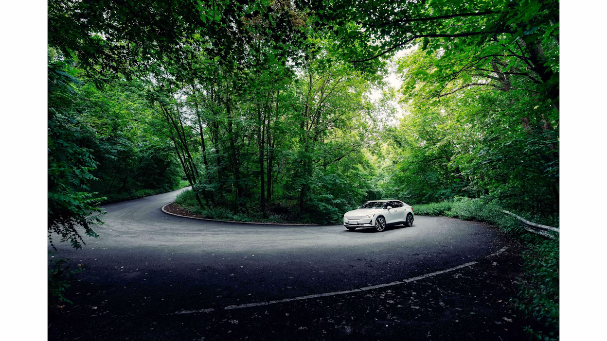 Polestar 2 driving up the forest in berlin