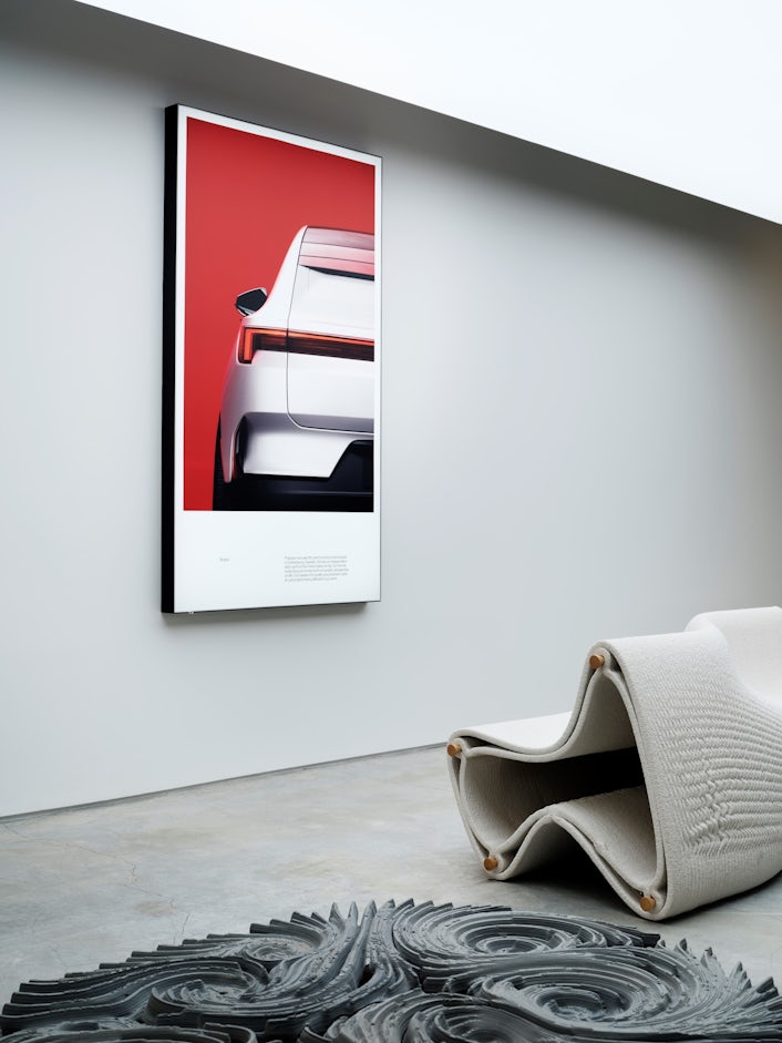 Artwork in Polestar Space with Polestar poster on wall