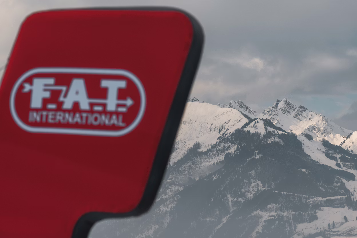 FAT ice logo in front of mountain range