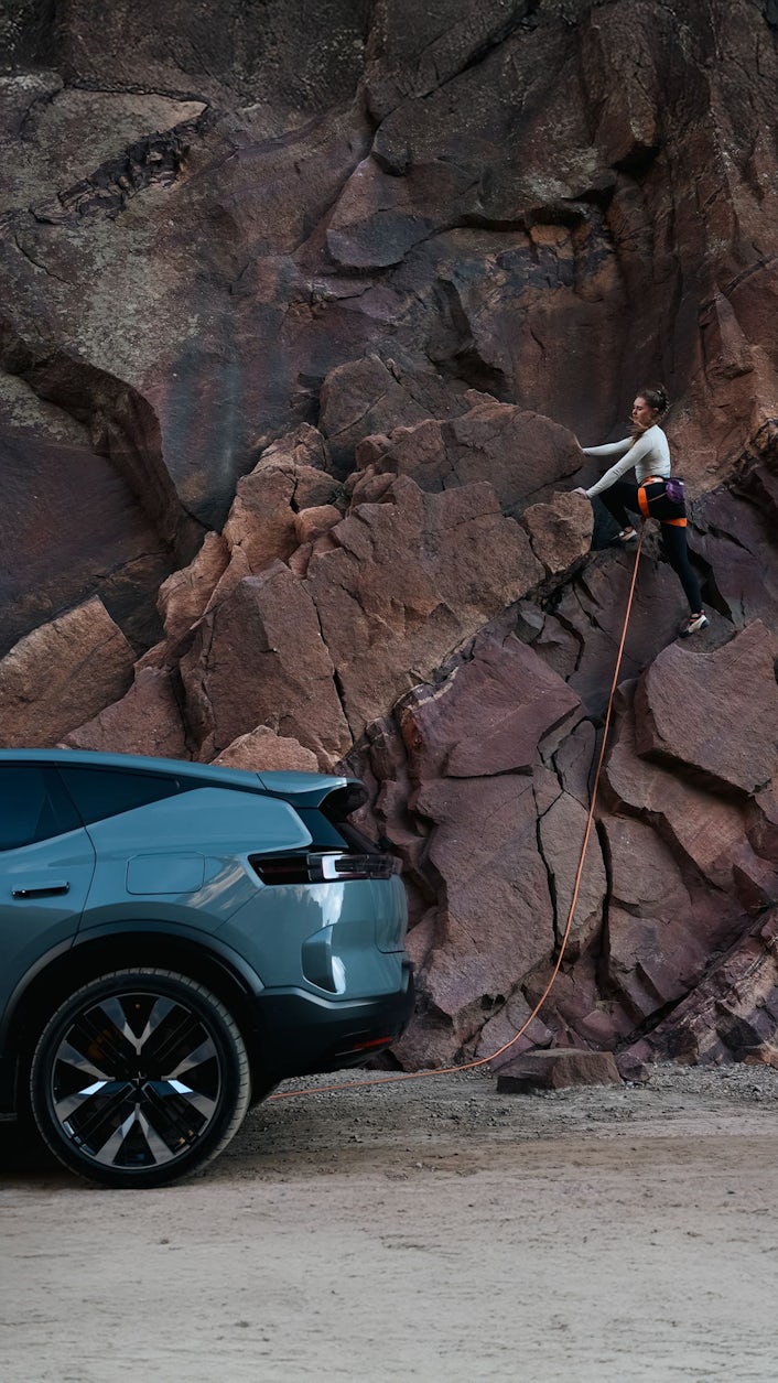 Margo Hayes climbing along side Polestar 3.