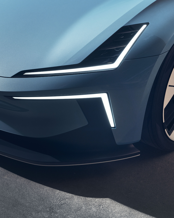 A close up, downward angled view of Polestar 6 showing the Polestar badge and front left wheel.