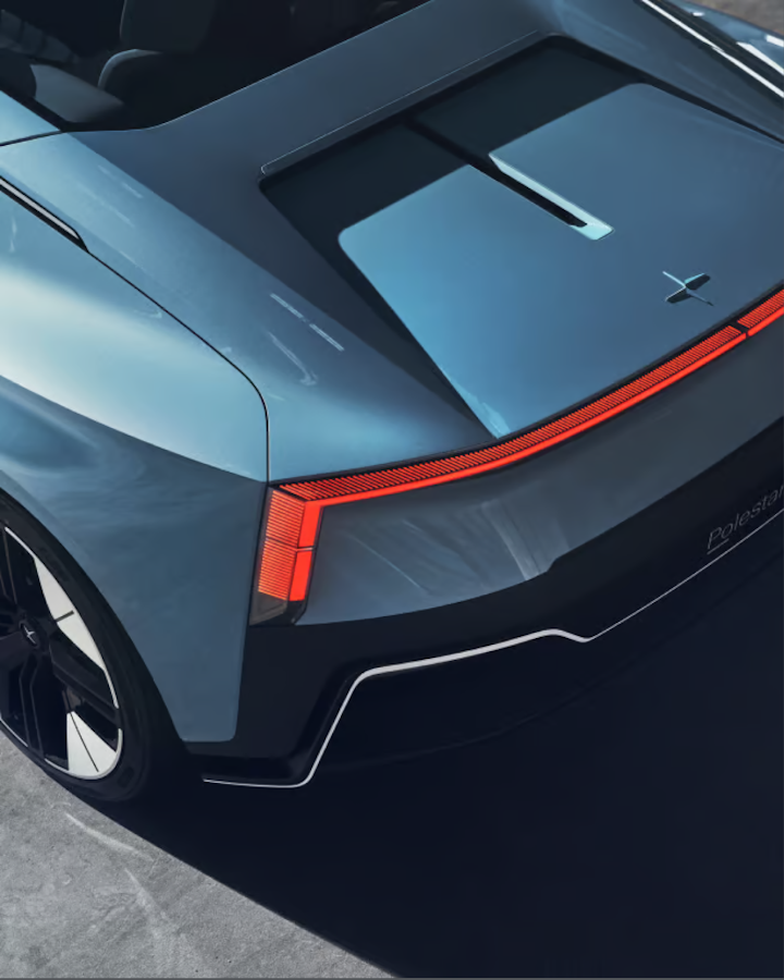 A close up, downward angled view of Polestar 6’s rear showing the aero blade and Polestar badge.