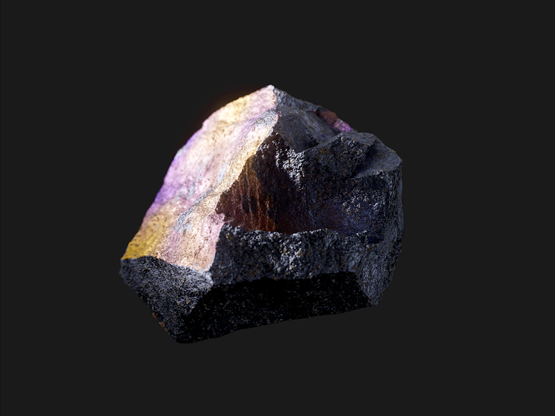 Rock with rough texture and multicolored surface on black background.