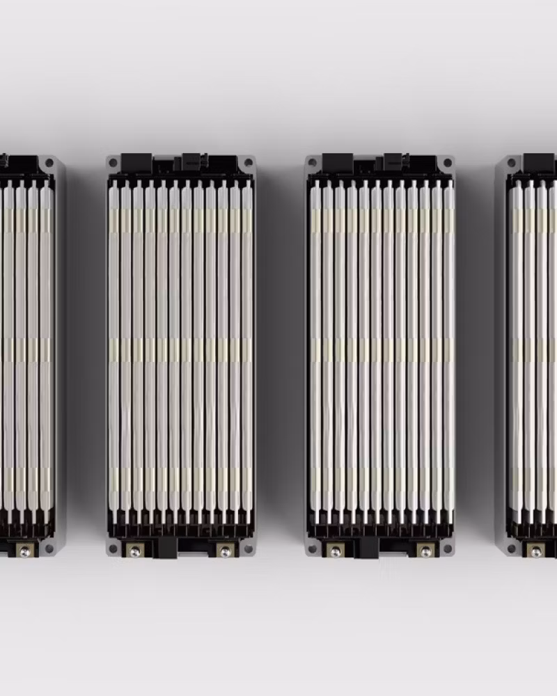 Four battery modules aligned horizontally on a white background.