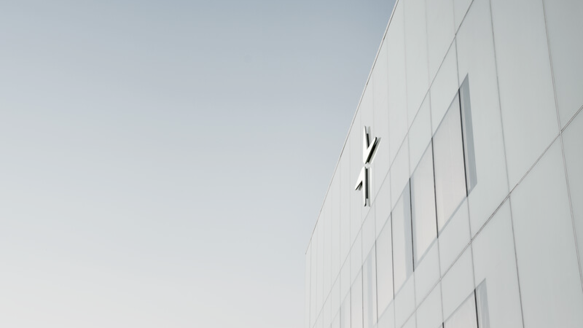 The white facade of Polestar HQ with the logo on top