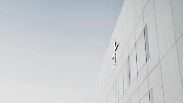 The white facade of Polestar HQ with the logo on top