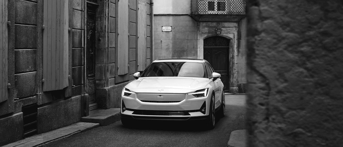 Polestar 2 in a quiet street setting, three quarter from the front view