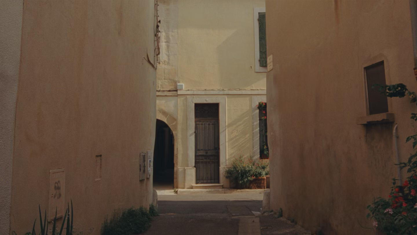 Polestar 2 driven through narrow streets and on a motorway by the side of a mountain.