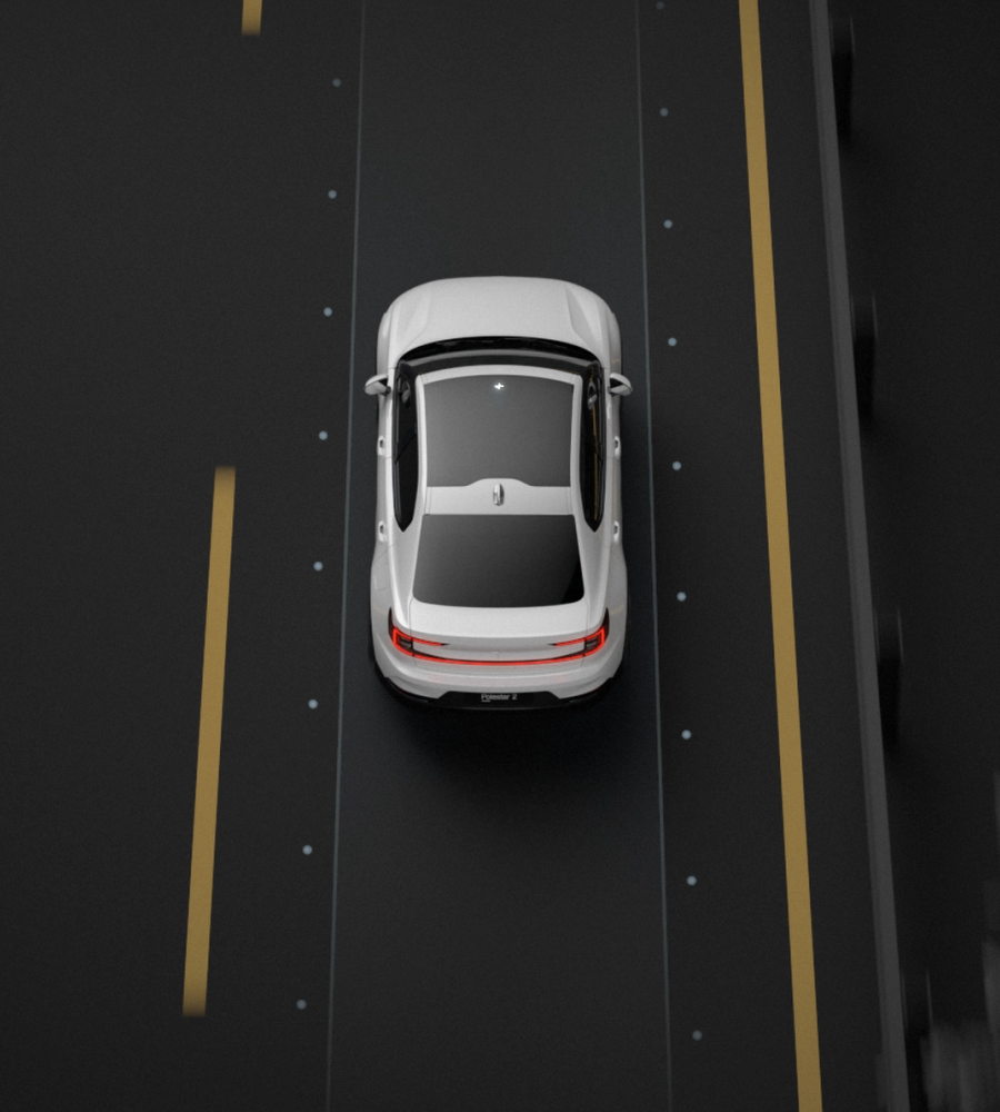 Polestar 2 driving on a curved road and staying in the centre with the help of Pilot assist.