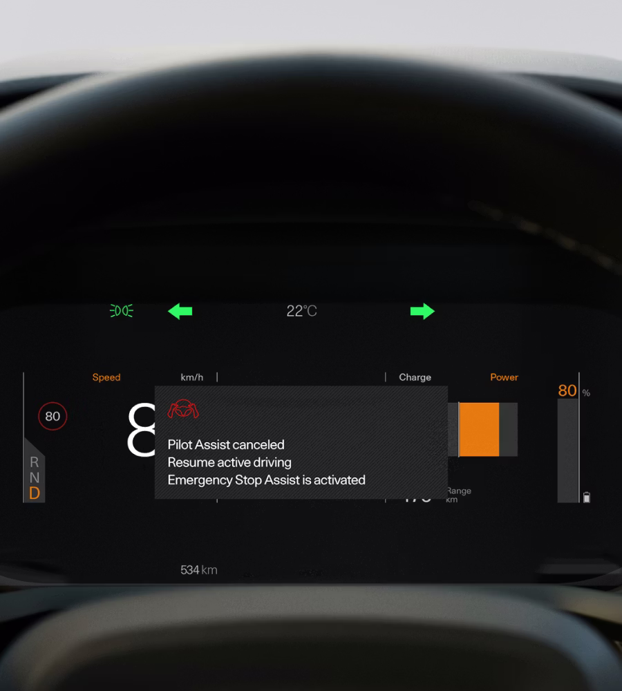 Polestar 2’s driver display showing an important message from the Emergency Stop Assist feature.