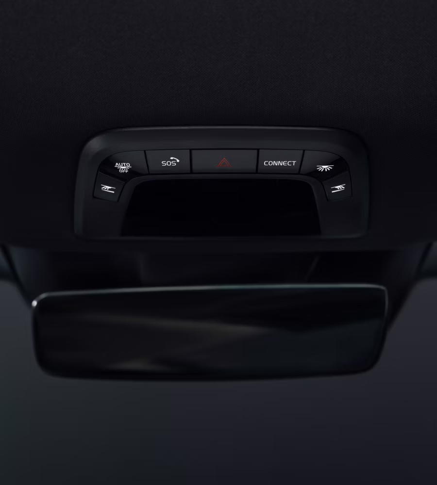 Polestar 3’s overhead console with illuminated buttons in a dark background.