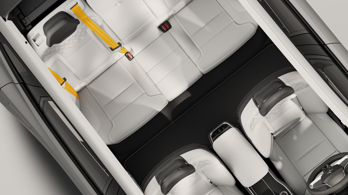 Angled bird’s eye view of Polestar 3’s interior showing all seats with Swedish gold seat belts.