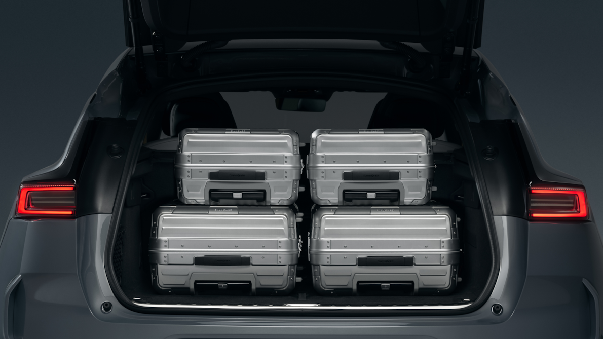Polestar 3’s rear hatch open and filled with two sets of different sized aluminium luggage.
