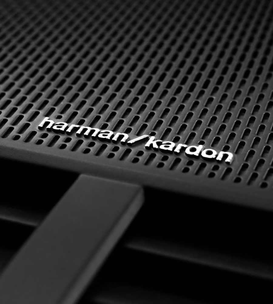 A Polestar 2 speaker with the Harman Kardon premium sound logo.