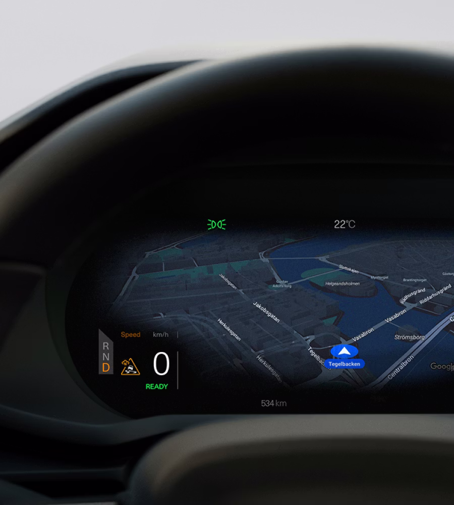 Polestar 2’s driver display with a hazard triangle and cloud sign from the Connected Safety feature.