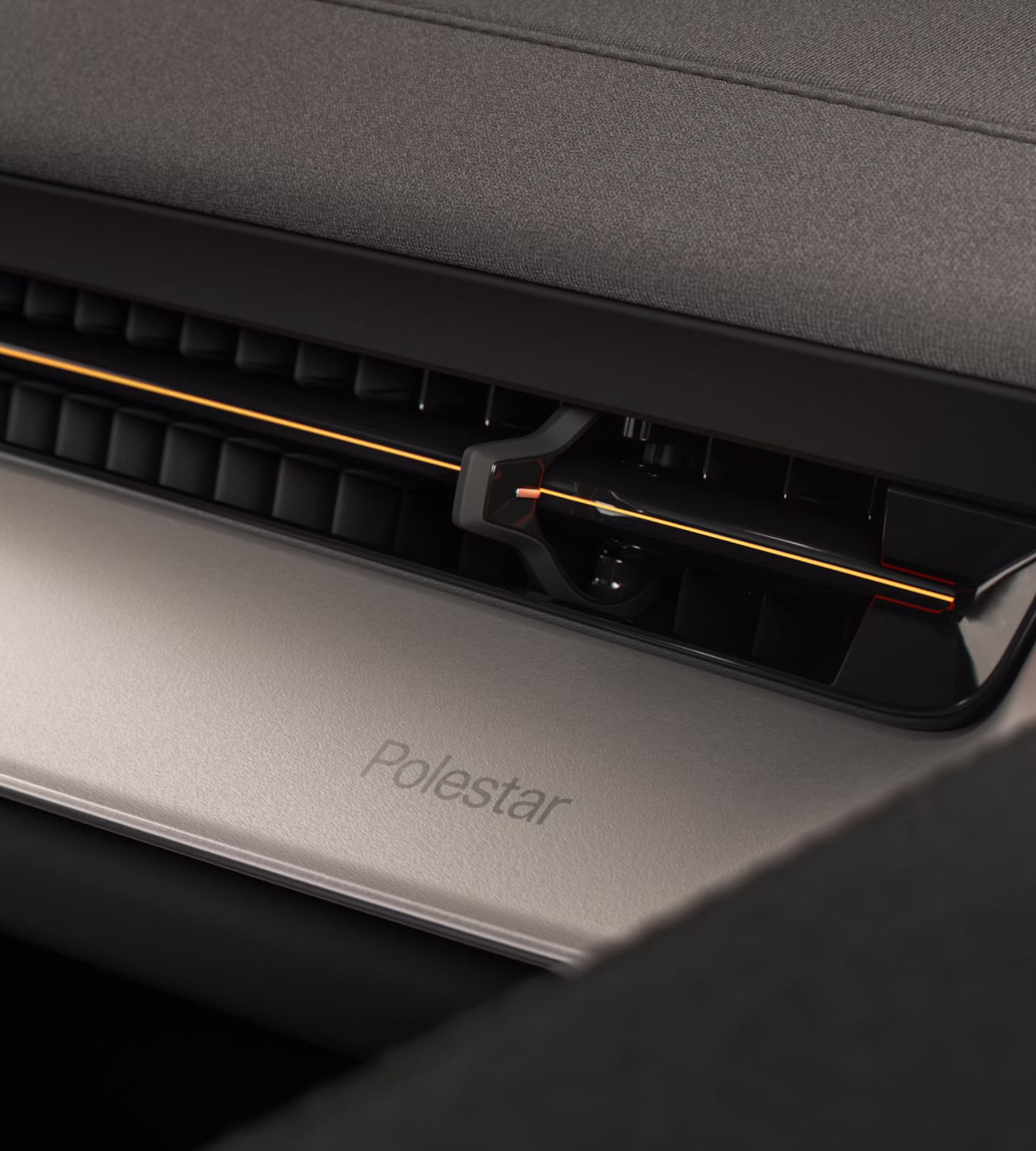 Close-up of Polestar 3’s Aluminium deco with a golden line across the ventilation.