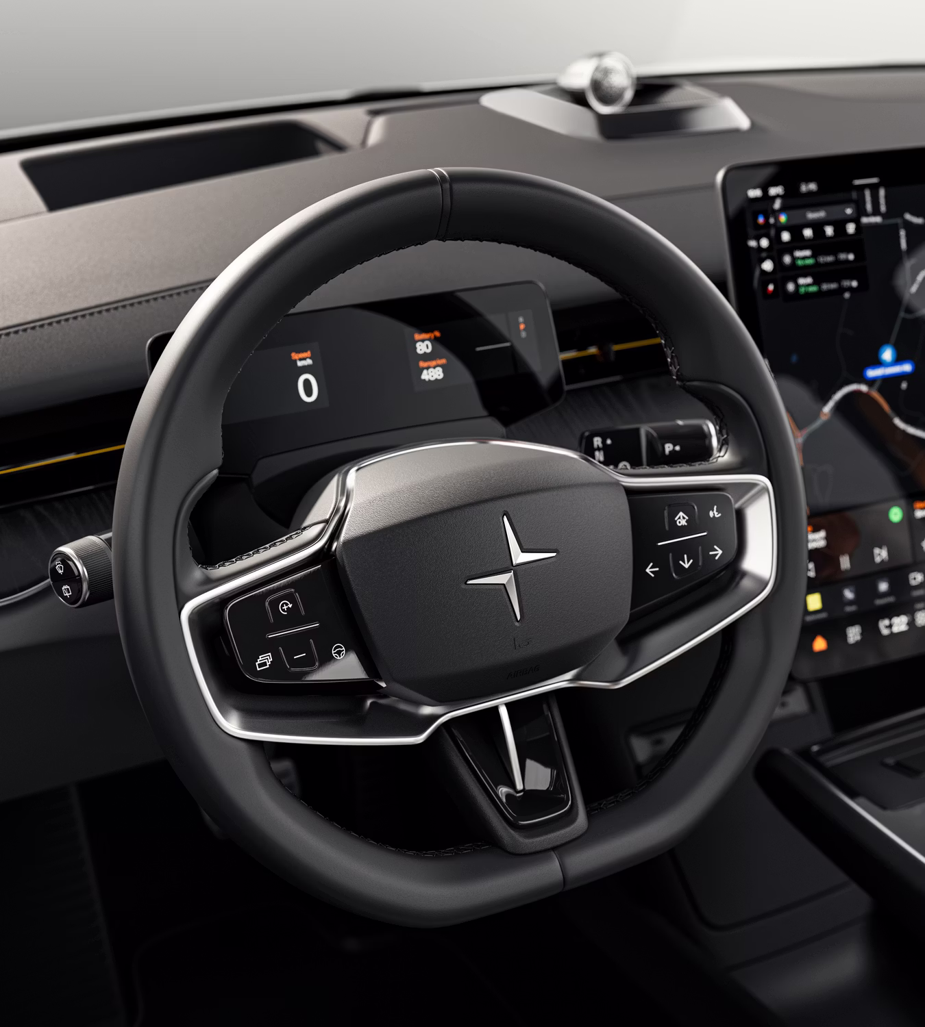 Polestar 3’s steering wheel with silver accents and Polestar logo in front of the driver display.