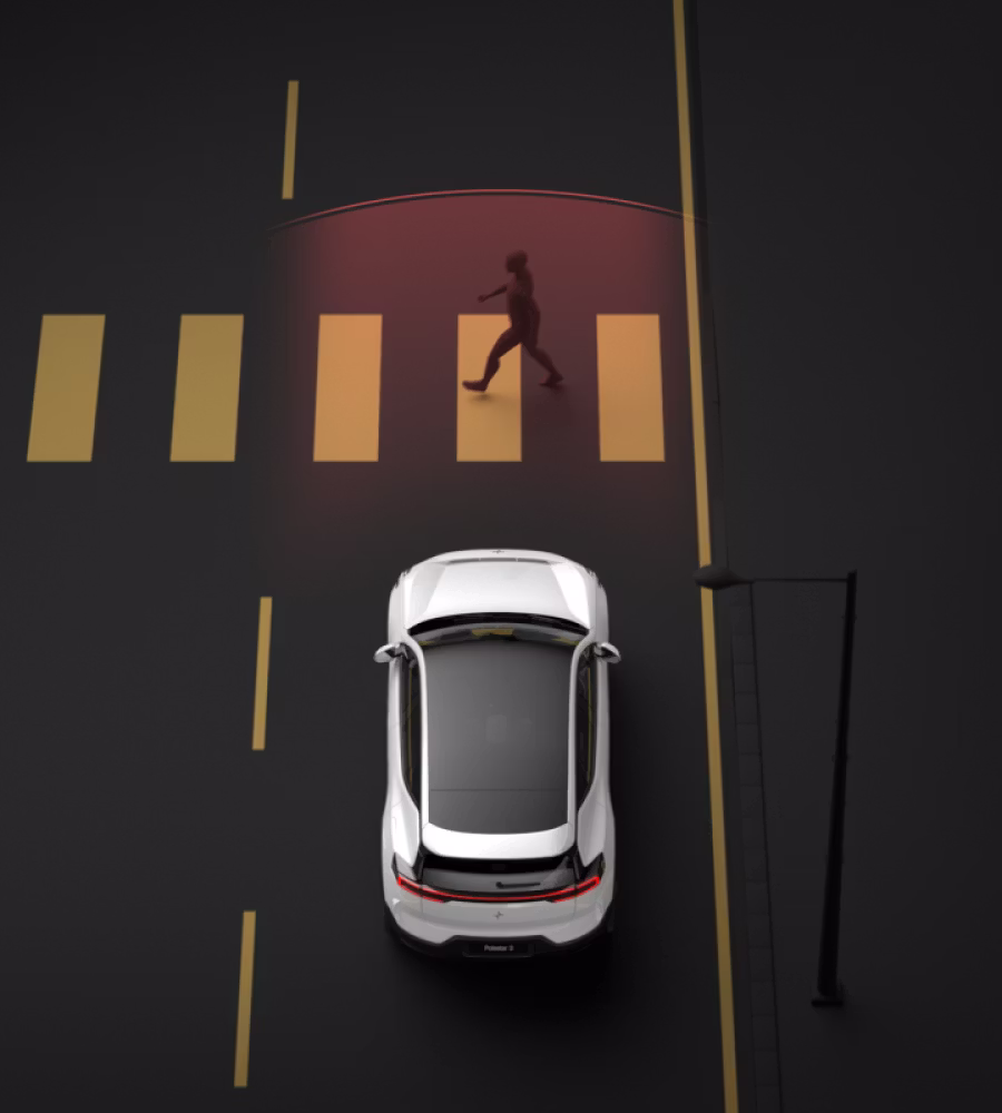 Polestar 3 driving and braking automatically when detecting a pedestrian on a marked crosswalk.