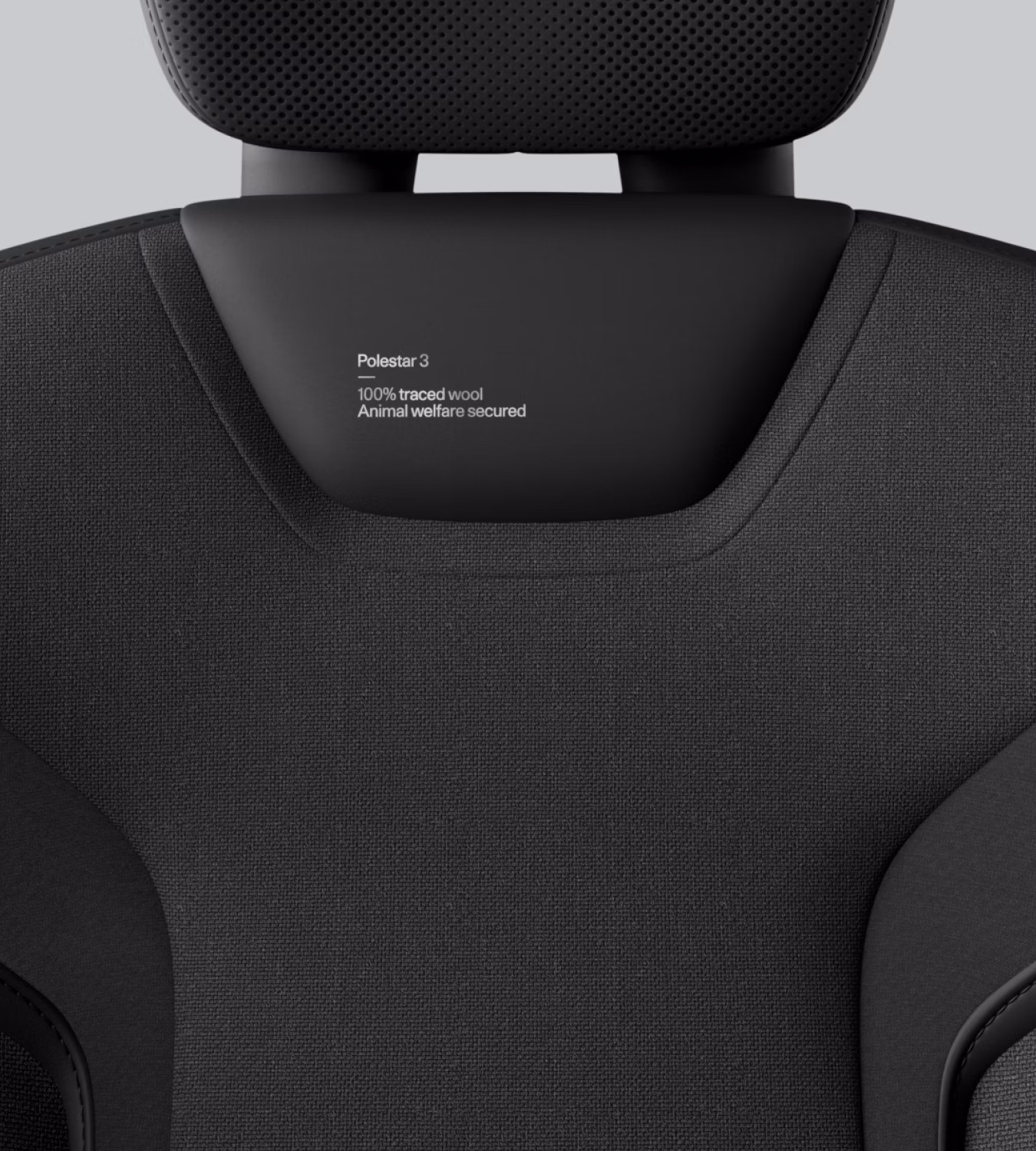 Close-up of Polestar 3’s Charcoal animal welfare-certified wool with textured patterns.