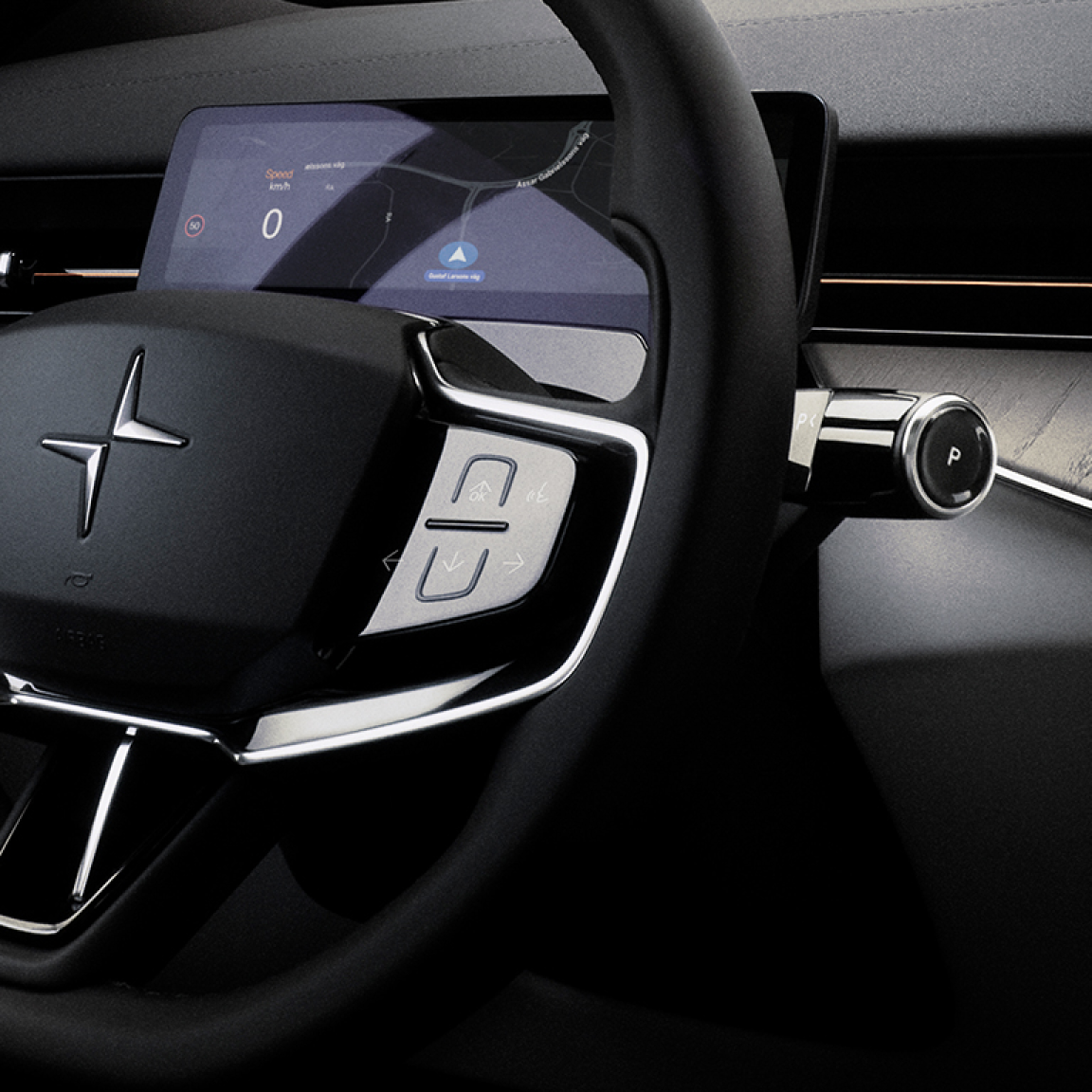 A close up of Polestar 3’s steering wheel with Polestar logo, indicator stalk, and buttons.