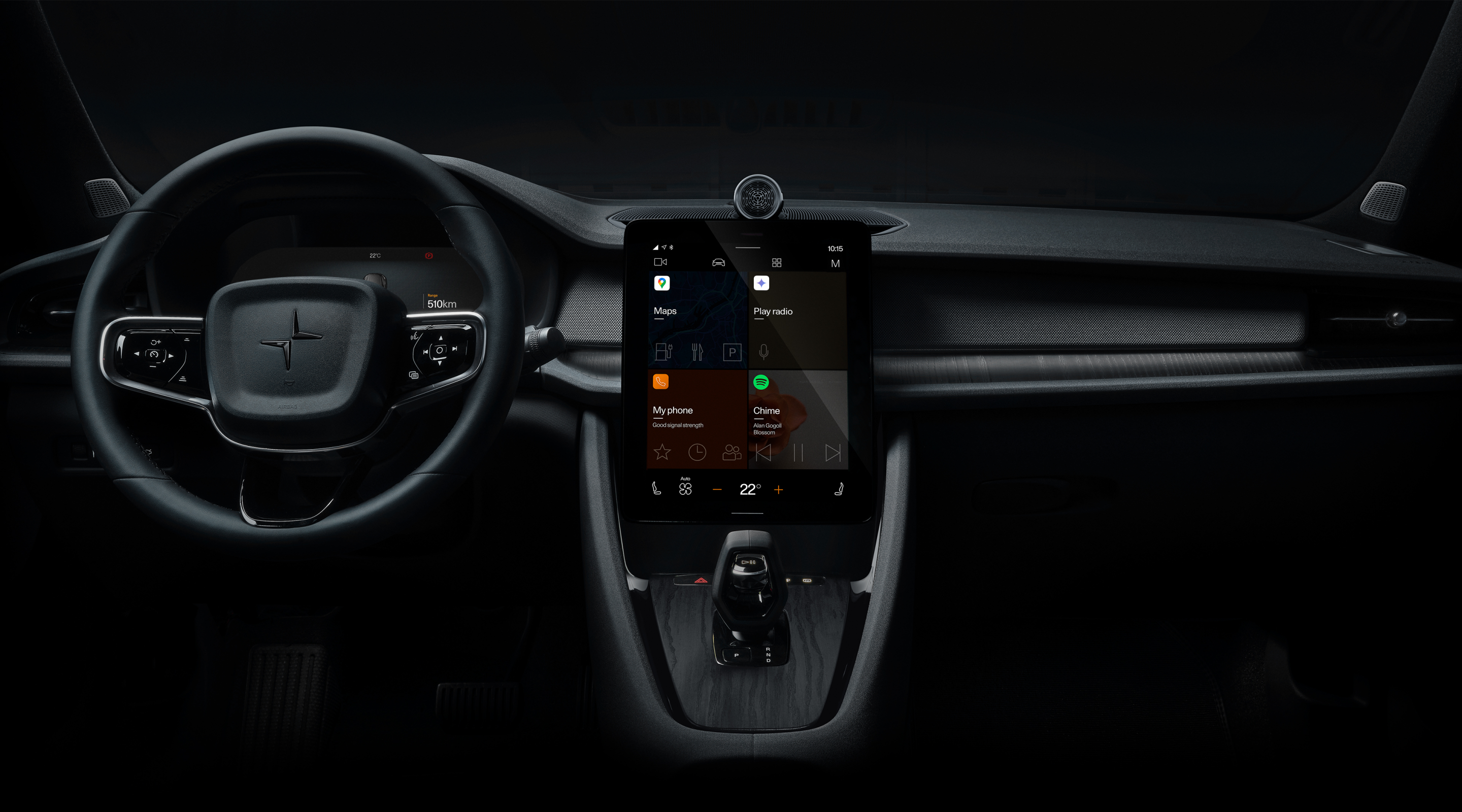 Polestar 2’s dashboard area with the steering wheel and centre display against a dark background.