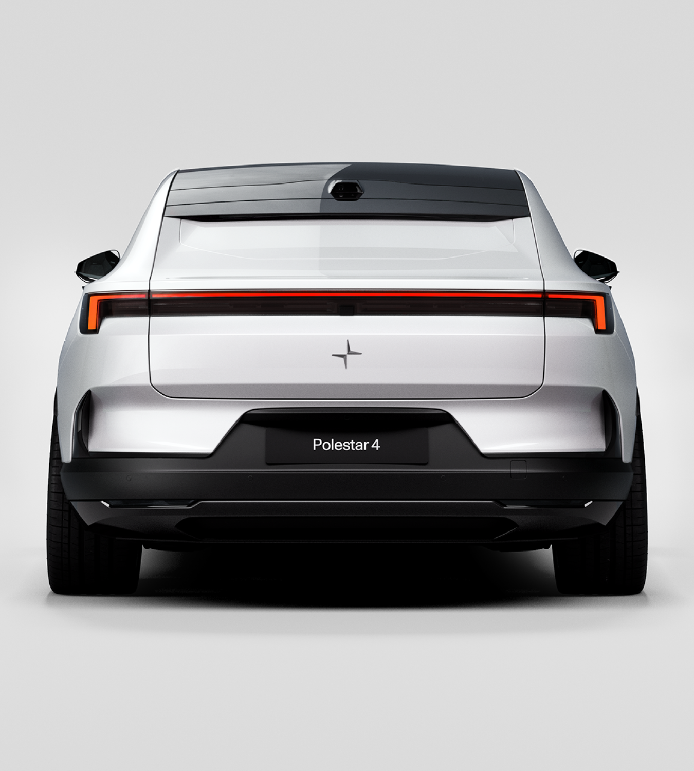 Rear view of a white Polestar 4 coupé against a white background.