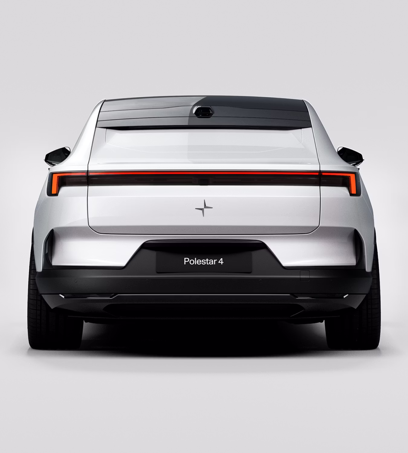 Rear view of a white Polestar 4 coupé against a white background.