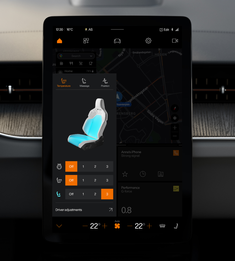 Car infotainment screen showing seat temperature and massage settings over a map