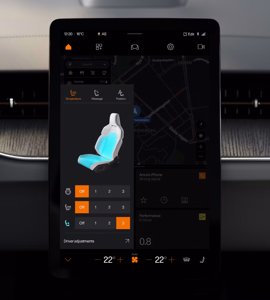 Car infotainment screen showing seat temperature and massage settings over a map