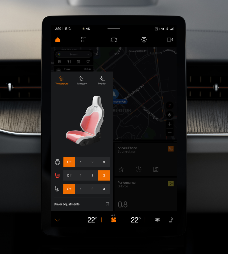 Car touchscreen showing seat temperature and massage controls over a map