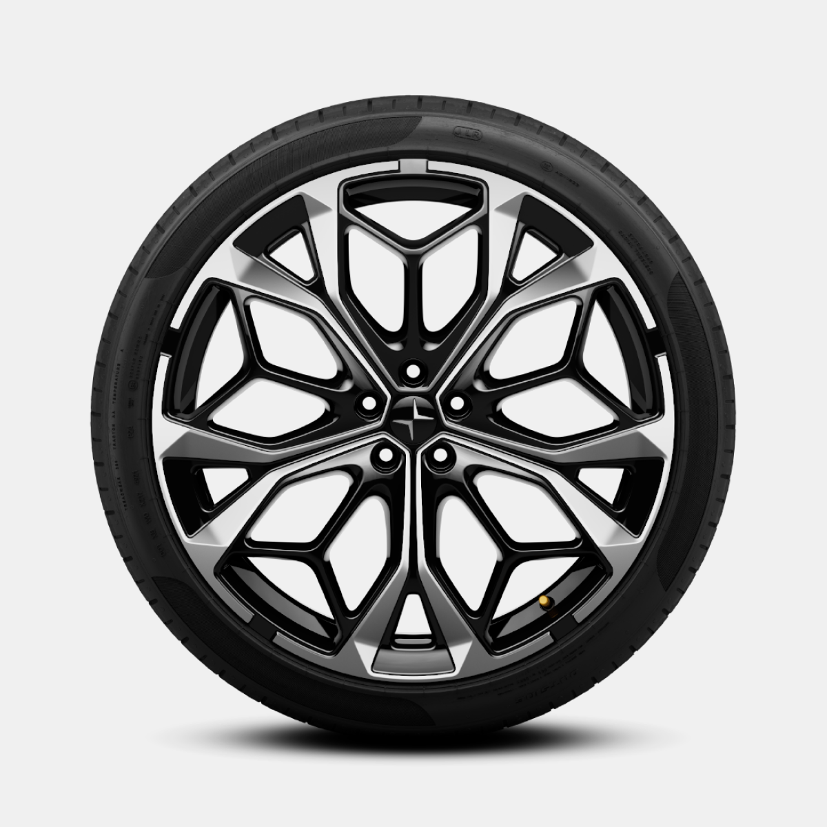 Polestar 4 SUV’s silver performance wheel with intricate geometric pattern.