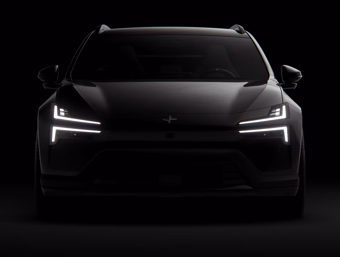 A black Polestar 4 SUV facing forward and standing against a black background.