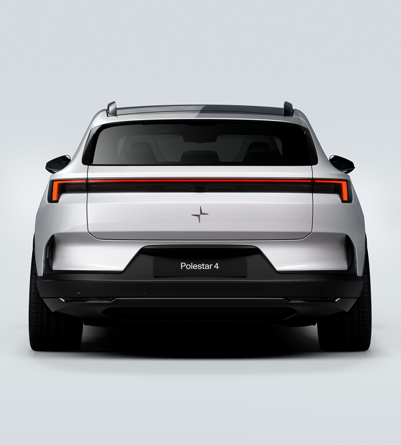 Rear profile view of a white Polestar 4 SUV in a white background.